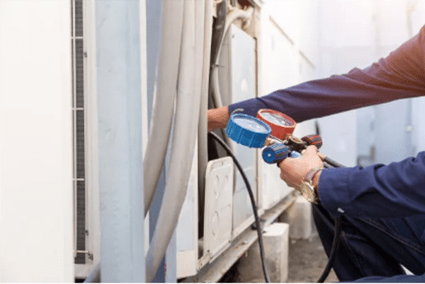 a professional is testing air conditioning equipment